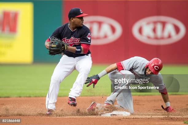 Cleveland Indians second baseman Jose Ramirez forces out Cincinnati Reds center fielder Billy Hamilton at second base as he looks to throw to first...