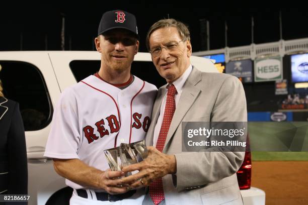 Drew of the Boston Red Sox is presented with the MVP trophy from Major League Baseball Commissioner Allan "Bud" Selig after the 79th MLB All-Star...