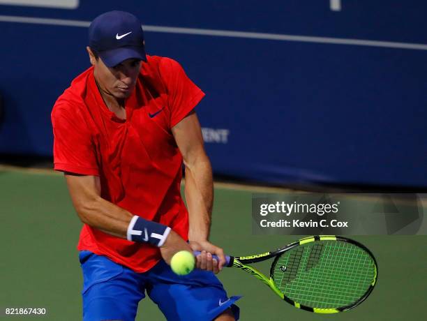 Ernesto Escobedo returns a backhand to Jared Donaldson during the BB&T Atlanta Open at Atlantic Station on July 24, 2017 in Atlanta, Georgia.