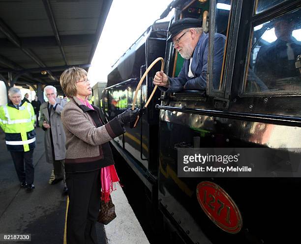 Kerry Prendergast, mayor of Wellington, hands the tablet over to the Locomotive driver during the Parliamentary train special from Wellington to...