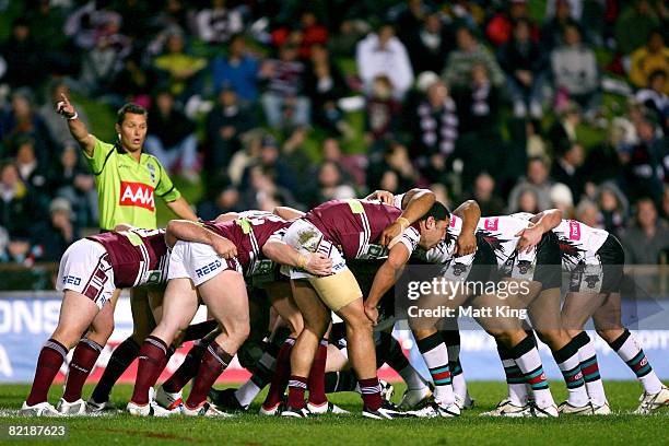 Players from the Sea Eagles and the Panthers form a scrum during the round 21 NRL match between the Manly Warringah Sea Eagles and the Penrith...