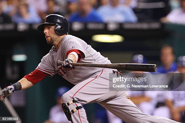 Dustin Pedroia of the Boston Red Sox watches a base hit against the Kansas City Royals at Kauffman Stadium August 5, 2008 in Kansas City, Missouri.