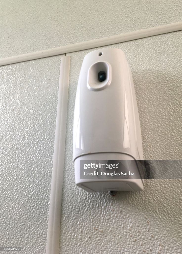 Wall mounted automatic air freshener