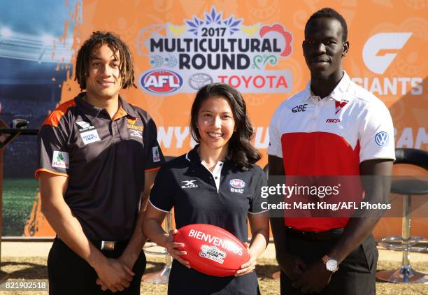 Tendai Mzungu of the GWS Giants, Mai Nguyen of the GWS Giants and Aliir Aliir of the Sydney Swans pose during the AFL Multicultural Round Media...