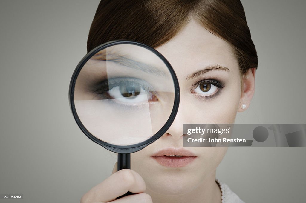 Girl with magnifying glass