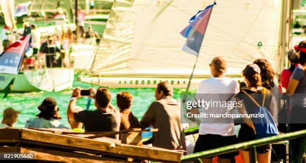 opening of ilhabela sailing week when the parade of sailboats happens in front of the píer da vila in ilhabela, brazil - píer stock pictures, royalty-free photos & images