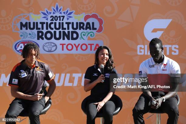 Tendai Mzungu of the GWS Giants, Mai Nguyen of the GWS Giants and Aliir Aliir of the Sydney Swans speak on stage during the AFL Multicultural Round...