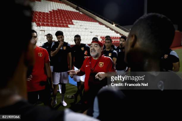 Diego Maradona, the new head coach of Fujairah FC speaks to players during a training session at Fujairah Stadium on July 24, 2017 in Fujairah,...