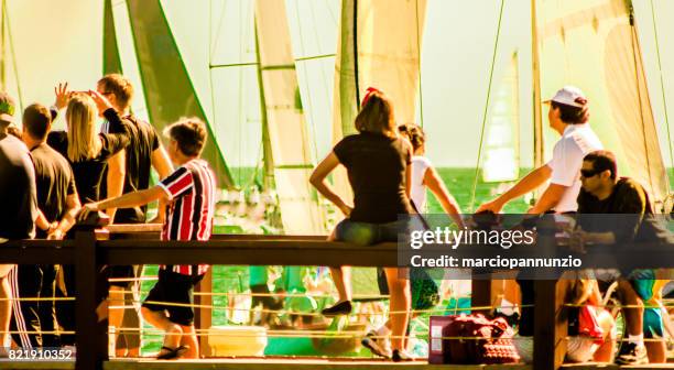 opening of ilhabela sailing week when the parade of sailboats happens in front of the píer da vila in ilhabela, brazil - píer stock pictures, royalty-free photos & images