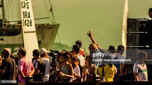 opening of ilhabela sailing week when the parade of sailboats happens in front of the píer da vila in ilhabela, brazil - píer stock pictures, royalty-free photos & images