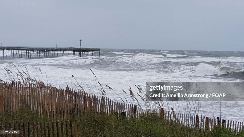 Distant view of pier in sea