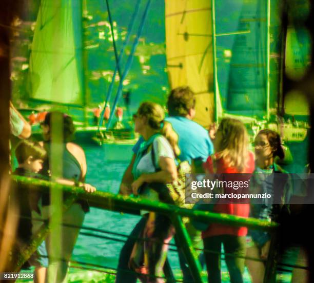 opening of ilhabela sailing week when the parade of sailboats happens in front of the píer da vila in ilhabela, brazil - píer stock pictures, royalty-free photos & images