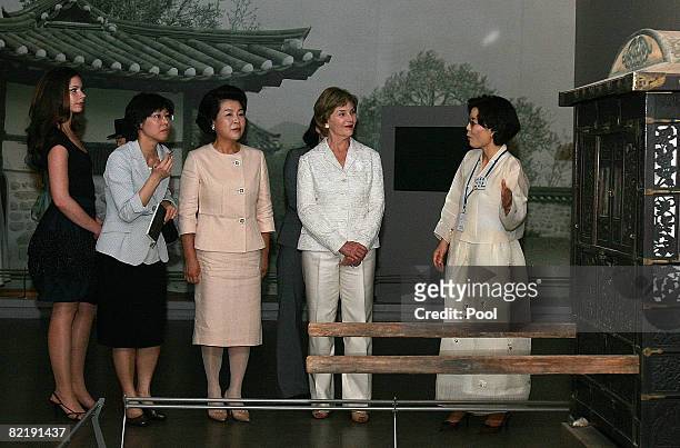 First lady Laura Bush , her daughter Barbara Bush and South Korean First lady Kim Yoon-Ok listens to an South Korean tour guide during their visit to...