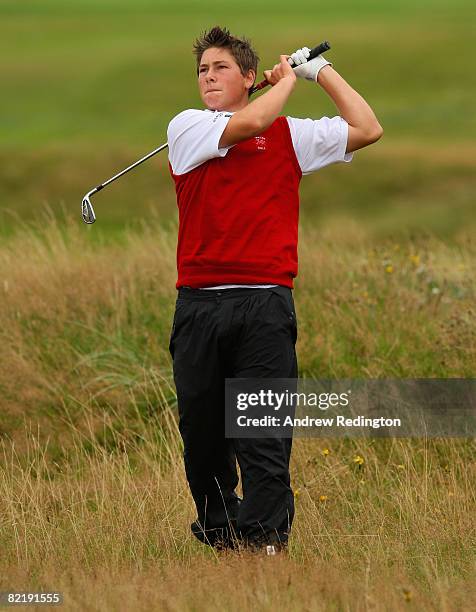 Ben Enoch of Wales plays from the rough on the 18th hole during the Boys Home Internationals at Royal County Down Golf Club on August 6, 2008 in...