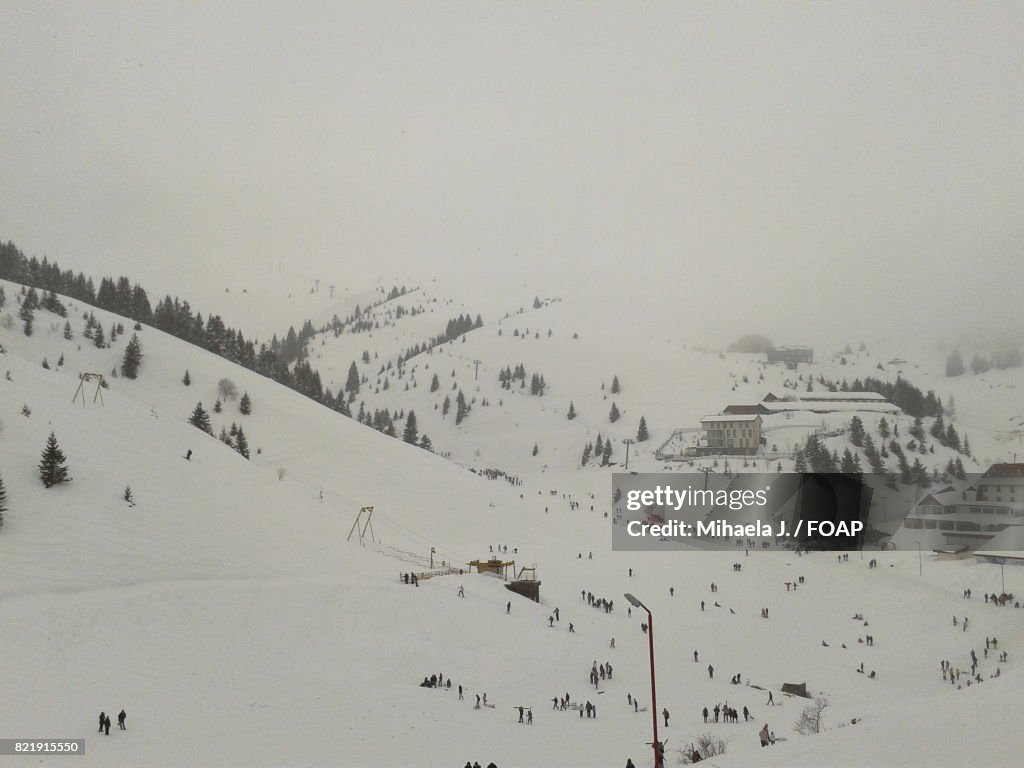 Snowy mountain covered in fog