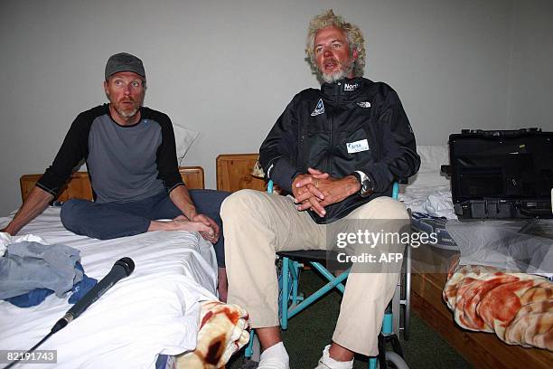 Dutch climber Las Van De Gevel and Wilco Van Rooijen pose at a hotel in Skardu on August 5 after their rescue from the slopes of K2 following an...
