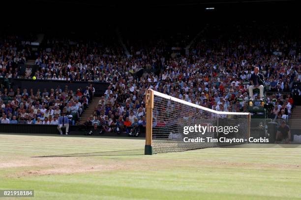 General view of the Umpire watching the ball fly over the net on Center Court during of the Wimbledon Lawn Tennis Championships at the All England...