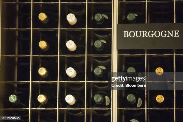 French wines sit on display at the Isetan Shinjuku department store, operated by Isetan Mitsukoshi Holdings Ltd., in Tokyo, Japan, on Tuesday, July...