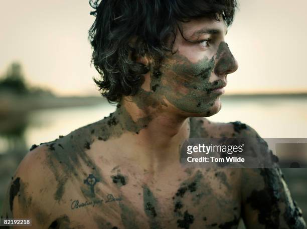 Man covered in mud