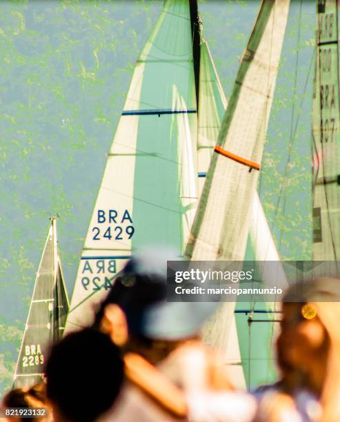 opening of ilhabela sailing week when the parade of sailboats happens in front of the píer da vila in ilhabela, brazil - píer stock pictures, royalty-free photos & images