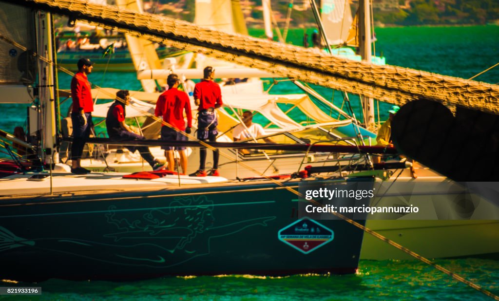 Opening of Ilhabela Sailing week when the parade of sailboats happens in front of the píer da vila in Ilhabela, Brazil