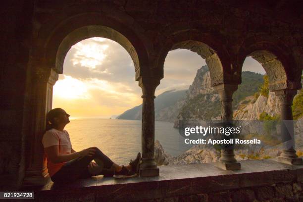 girl at sunset of portovenere, liguria - castle pillars stock pictures, royalty-free photos & images