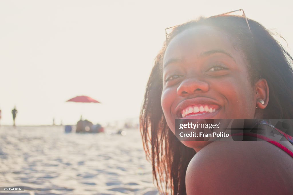 Beautiful young black woman smiling.