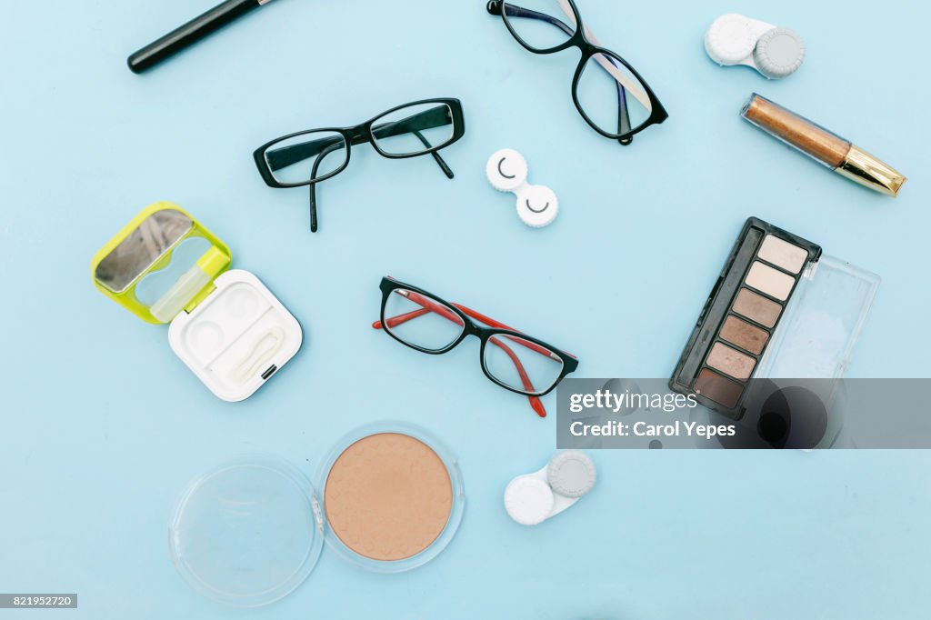 Eyeglasses and contact lenses  and make up.top view