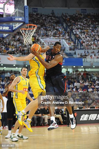 Dwight Howrd of the U.S. Men's Senior National Team rebounds against Australia on August 5, 2008 at the Qizhong Arena in Shanghai, China. The U.S....