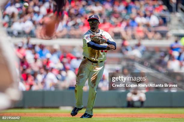 Adonis Garcia of the Atlanta Braves throws to first base against the St. Louis Cardinals at SunTrust Park on May 7, 2017 in Atlanta, Georgia. The...