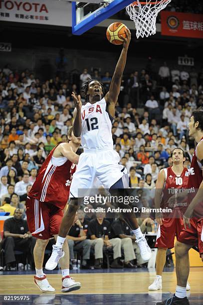 Chris Bosh of the U.S. Men's Senior National Team shoots a layup during a Pre-Season Friendly against Turkey on July 31, 2008 at the Cotai Arena in...