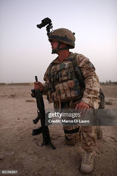 British Army Regimental Sergeant Major from the 3rd Battalion The Parachute Regiment, Morgan David Bridge secures the helicopter landing strip during...