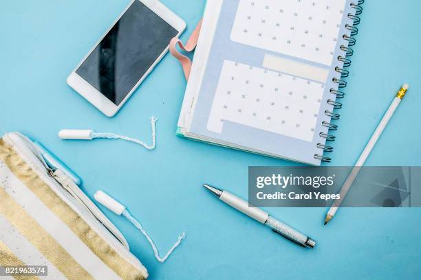 tampon and calendar in blue background - calendar 2017 stock pictures, royalty-free photos & images