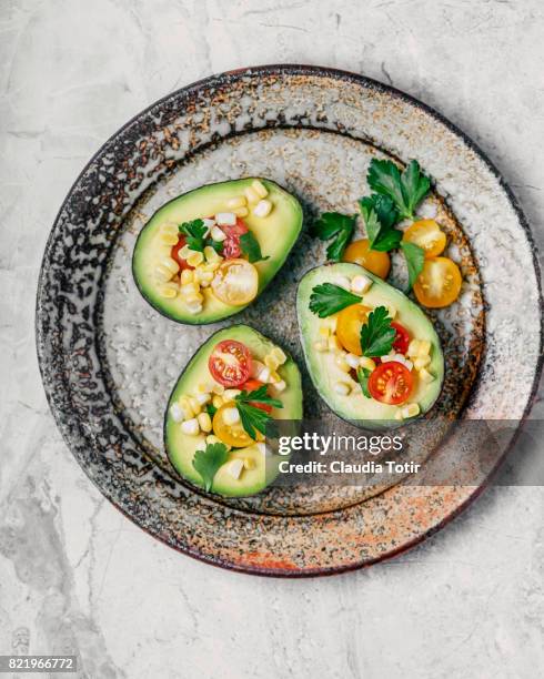 stuffed avocado - stuffed avocado stock pictures, royalty-free photos & images