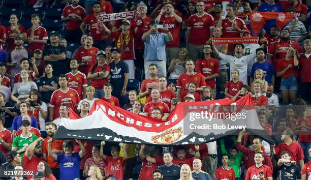 Manchester United fans cheer for their team against Manchester City at NRG Stadium on July 20, 2017 in Houston, Texas.