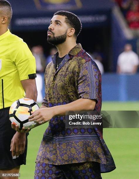 Rapper/Singer Drake brings out the game ball with the officials at NRG Stadium on July 20, 2017 in Houston, Texas.