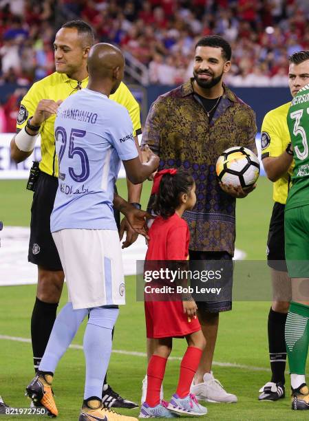 Rapper/Singer Drake brings out the game ball with the officials at NRG Stadium on July 20, 2017 in Houston, Texas.