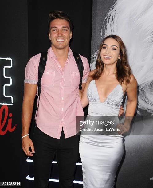 Dean Unglert and Ashley Iaconetti attend the premiere of "Atomic Blonde" at The Theatre at Ace Hotel on July 24, 2017 in Los Angeles, California.