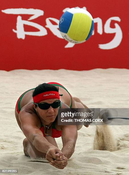 World and olympic champion Misty May-Treanor returns the ball to her teammate Kerri Walsh during a practice session at Beijing's Chaoyang Park Beach...
