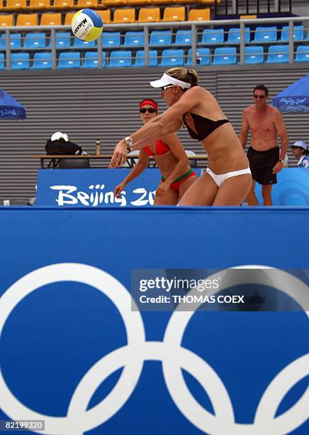 World and olympic champion Kerri Walsh returns the ball to teammate Misty May-Treanor during a practice session at Beijing's Chaoyang Park Beach...