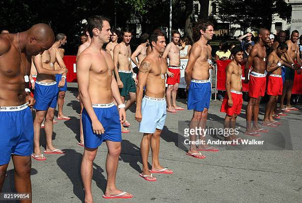 Men wait to be sized up at the Levi's "Size Does Matter" game on August 6, 2008 in New York City.