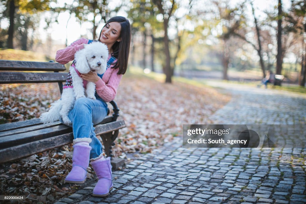 Girl with cute dog in park