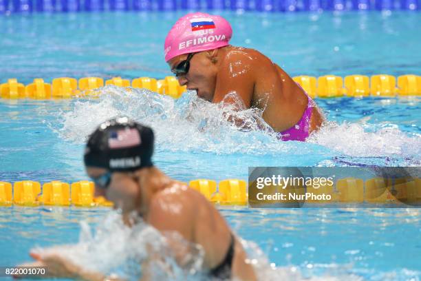 Katie Meili and Yuliya Efimova of Russia compete in a women's 100m breaststroke semi-final during the swimming competition at the 2017 FINA World...