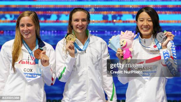 Madisyn Cox , Hungary's Katinka Hosszu and Japan's Yui Ohashi celebrate on the podium after the women's 200m Individual Medley final during the...