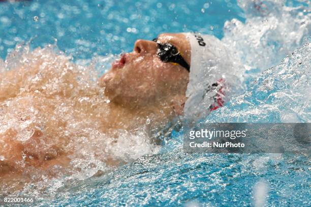 Tomasz Polewka , competes in a heat of the women's 100M Backstroke during the swimming competition at the 2017 FINA World Championships in Budapest,...