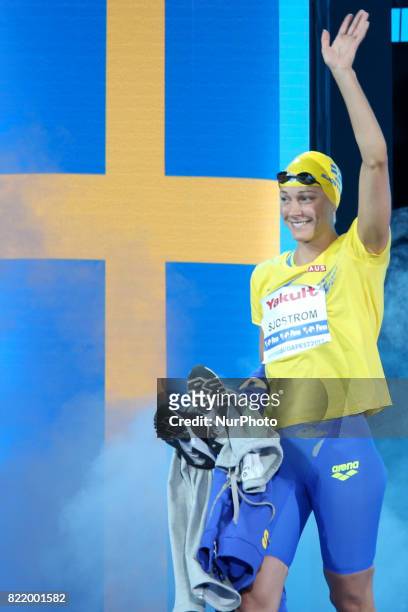 Sarah Sjostrom of Sweden reacts after wins gold in the women's 100m butterfly at the 17th FINA World Masters Championships in Budapest.