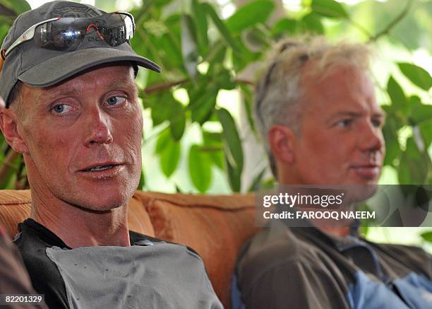 Dutch climbers Las Van De Gevel and Wilco Van Rooijen talk with media representatives on their return in Islamabad on August 7, 2008. Gevel and...