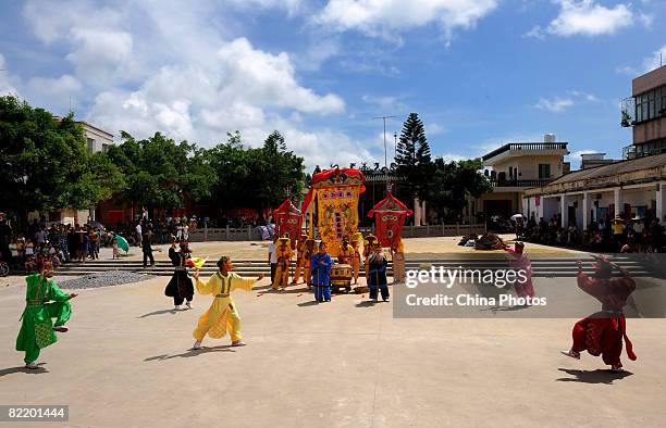 Villagers perform during the performance of Nuowu Dancing, an ancient dance with a history dating back over 2000 years ago, in Jiuxian Village on...