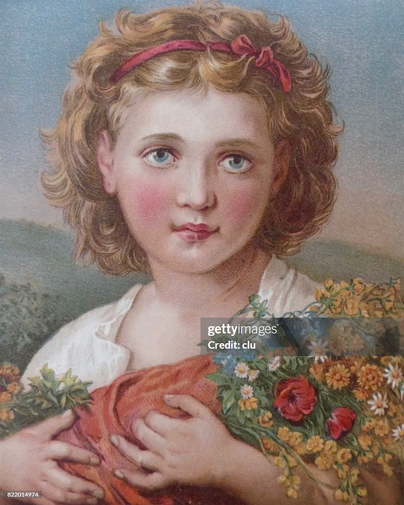 夏の花の花束を保持しているブロンドの女の子