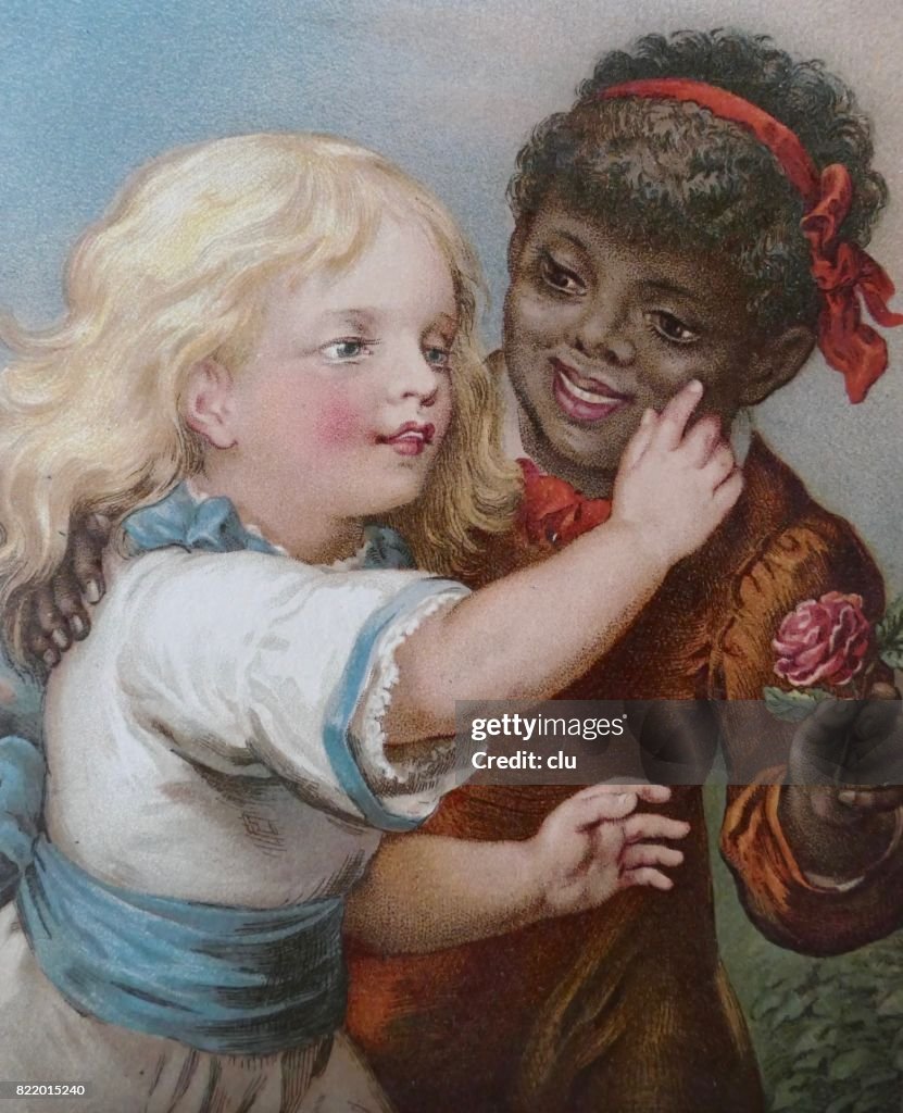 Blond girl touching the skin of a black african girl